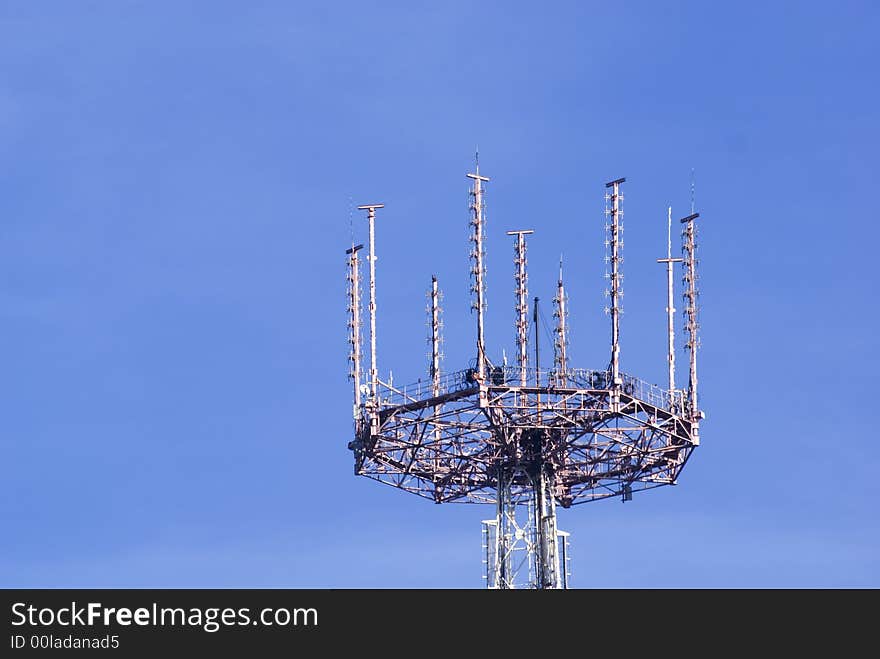 Telecommunication tower on the sky background