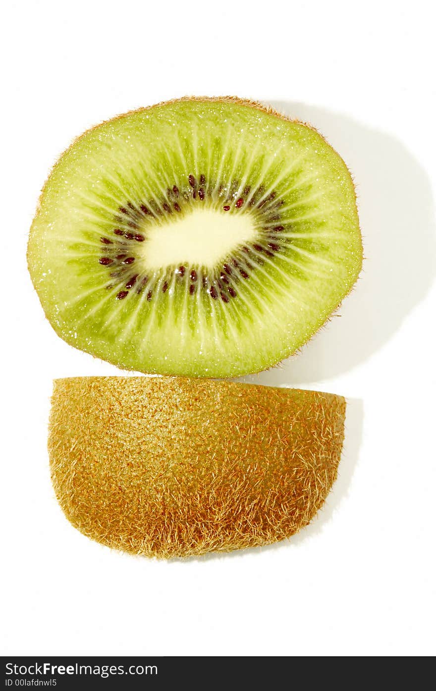 Close up of kiwi slice with side view of its skin on white background. Close up of kiwi slice with side view of its skin on white background