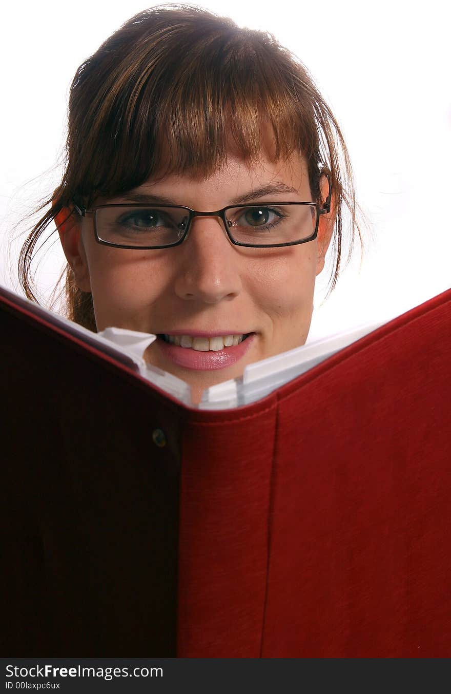 A young student is reading a book.