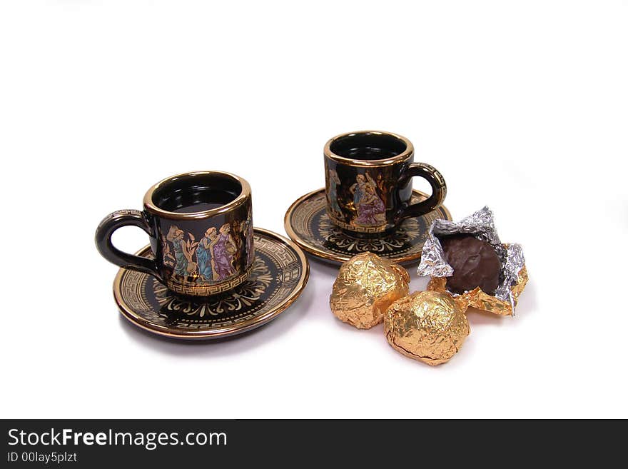 Two painted cups of coffee and sweet on a white background. Two painted cups of coffee and sweet on a white background.