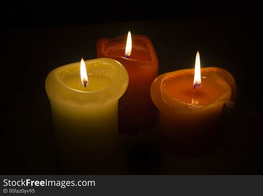 Three romantic candles in the autumn time