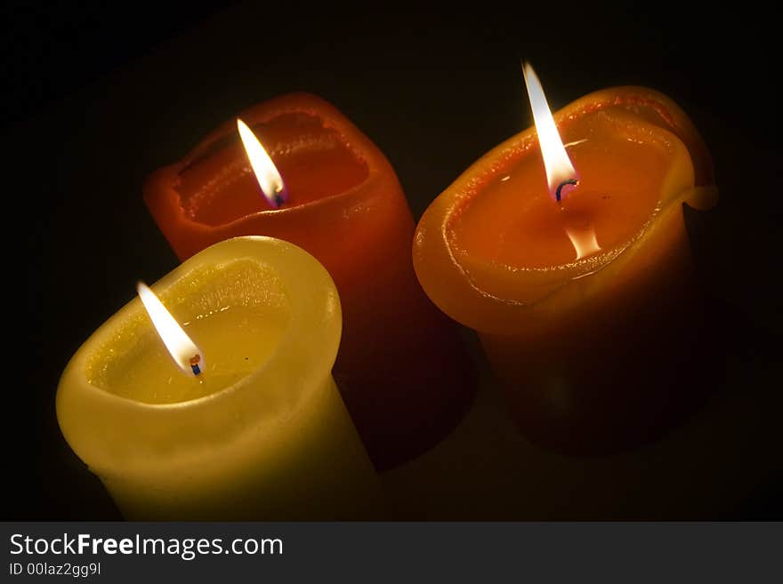 Three romantic candles in the autumn time