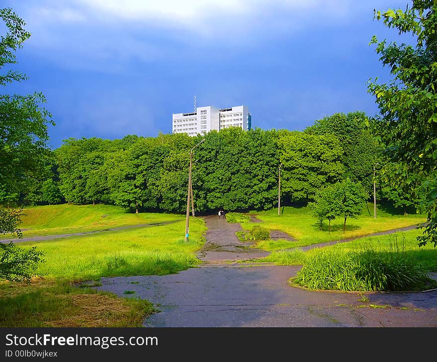 Road to big house in sunset light after rain. Shot in Dniepropetrovsk Nat'l University campus, Ukraine