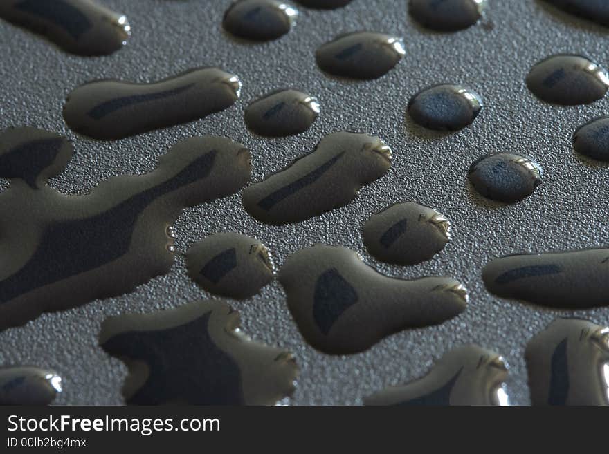 Water drops on rough black surface