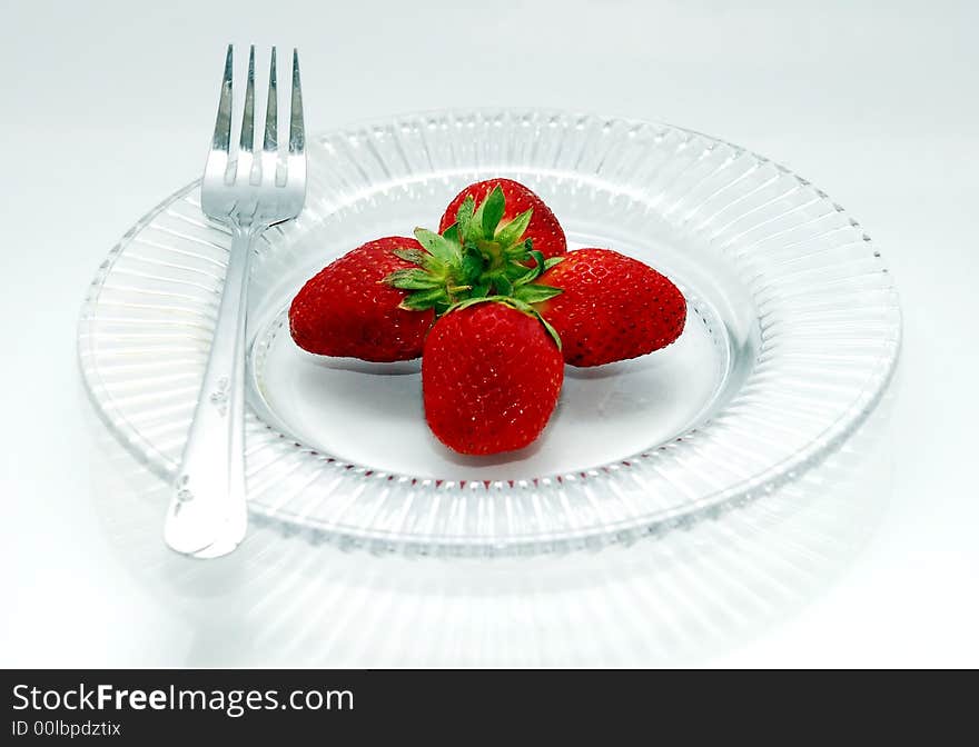 Beautiufl focus a strawberry fruits image in the glass plates. Beautiufl focus a strawberry fruits image in the glass plates