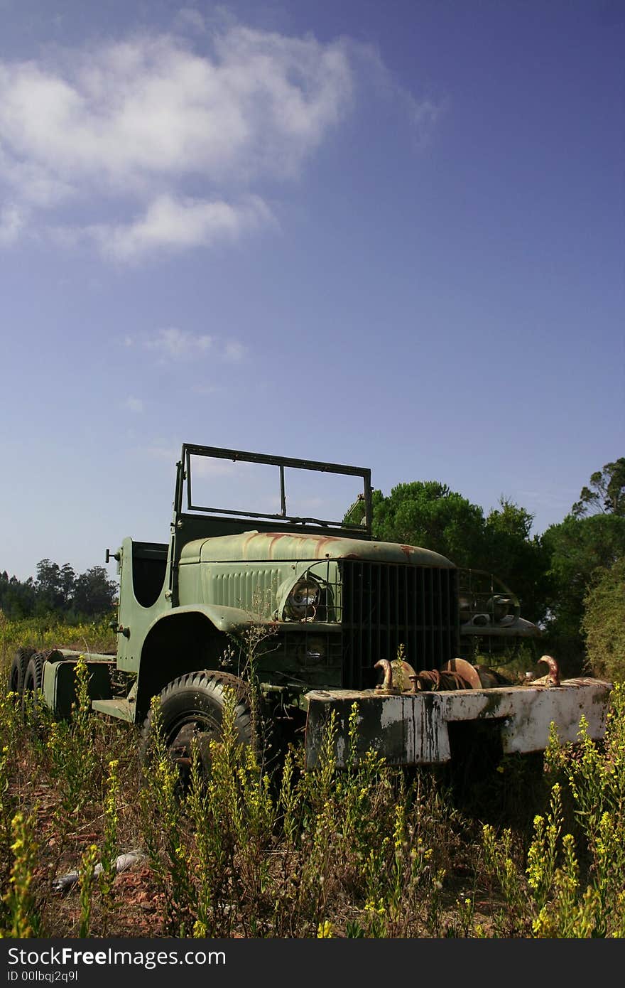 That old car are in midlle of the land. That old car are in midlle of the land