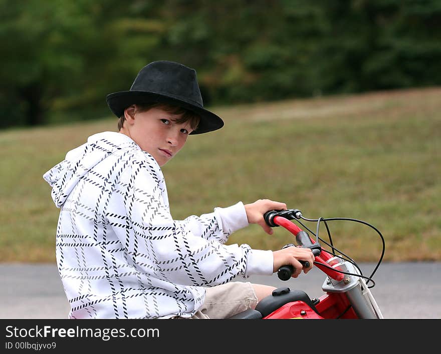 Boy sitting on dirtbike