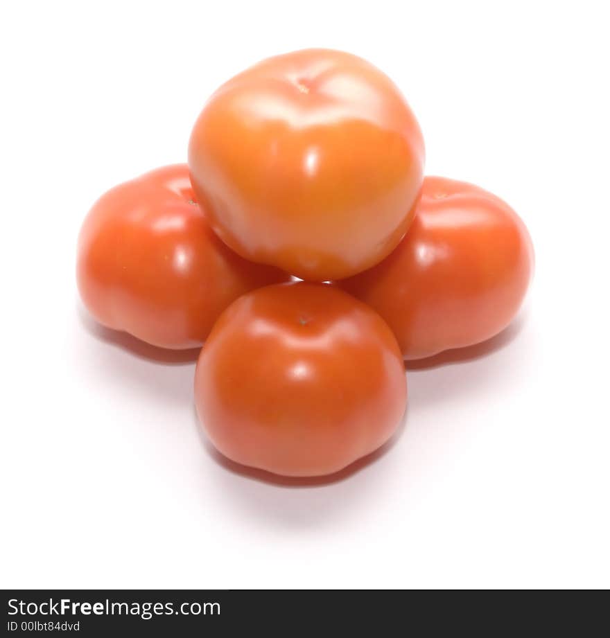 Juicy ripe tomatoes on white. Full isolation on white. Juicy ripe tomatoes on white. Full isolation on white.