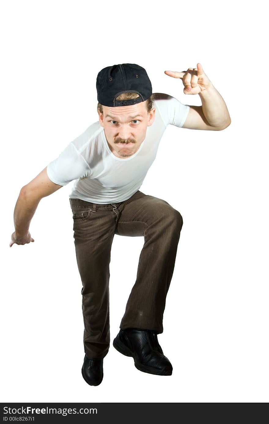 Tough guy in peaked cap and jeans. Isolated on white.