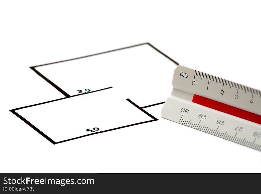 A blueprint and a scale ruler against white background. A blueprint and a scale ruler against white background.