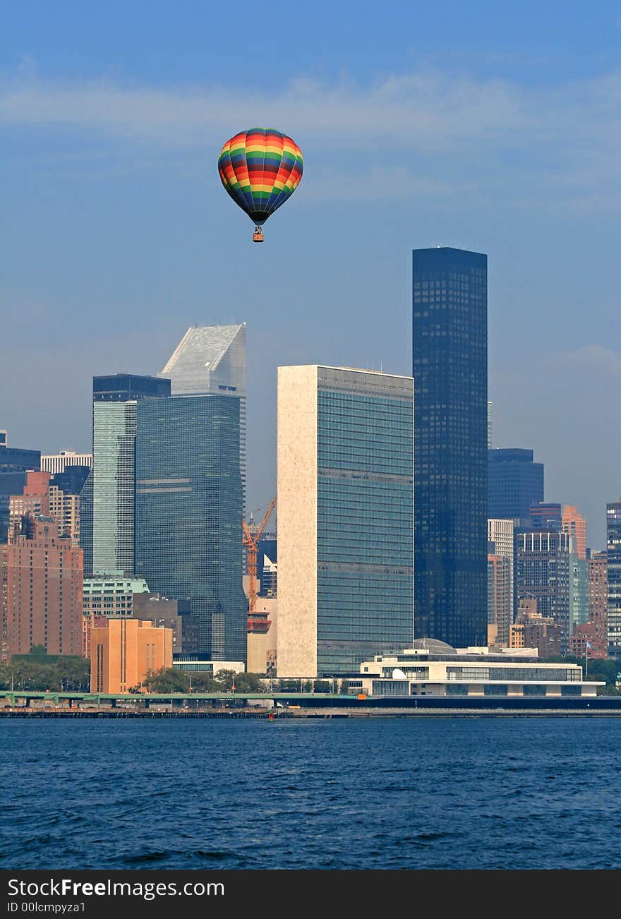 Hot air balloon flying over The United Nations Building in New York City