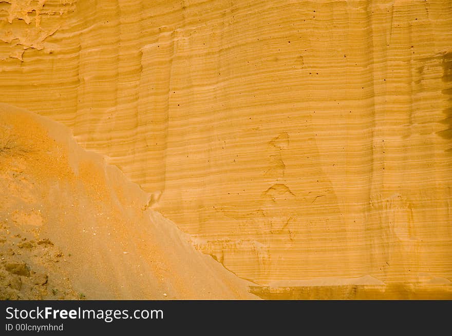 Human-made sand canyon enlightened by the sun