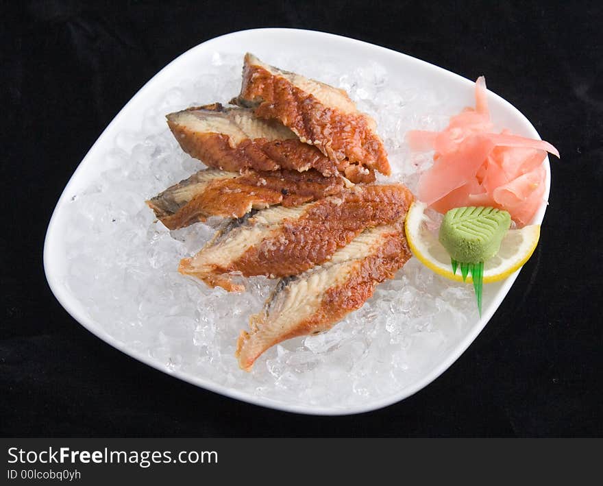 Sashimi in ice (isolated in black)