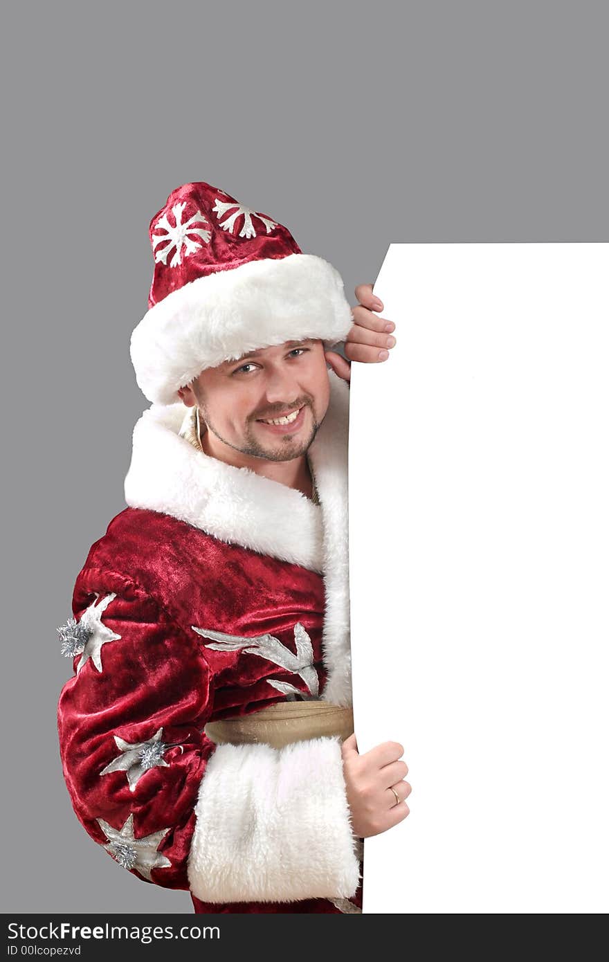 Santa Claus carrying a white paper for advertisement