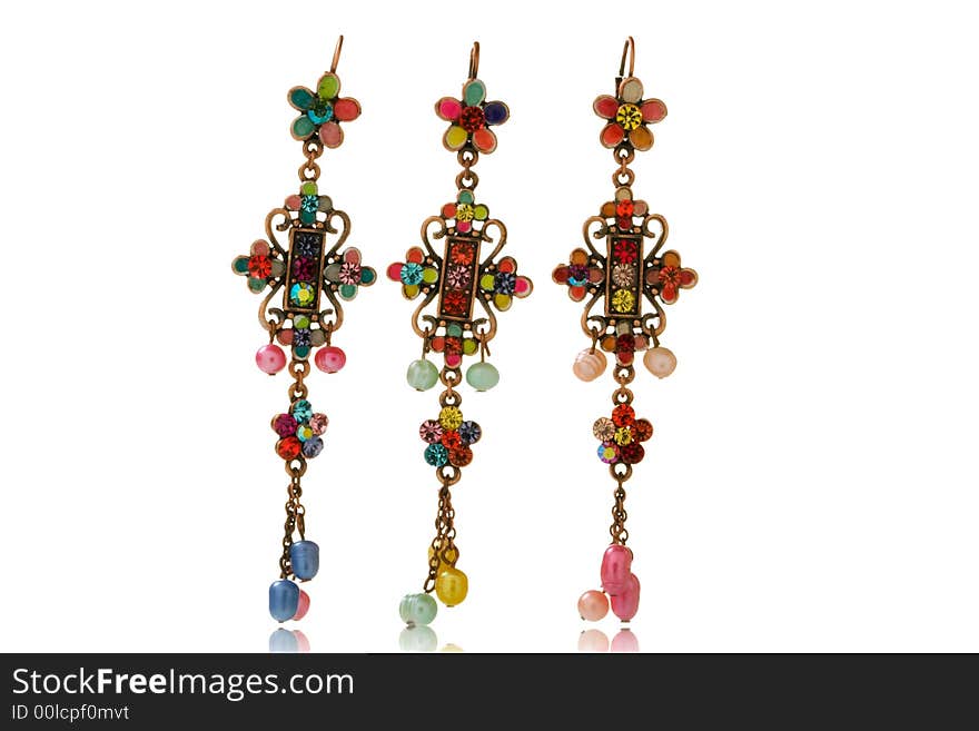 Colorful earrings isolated over white background