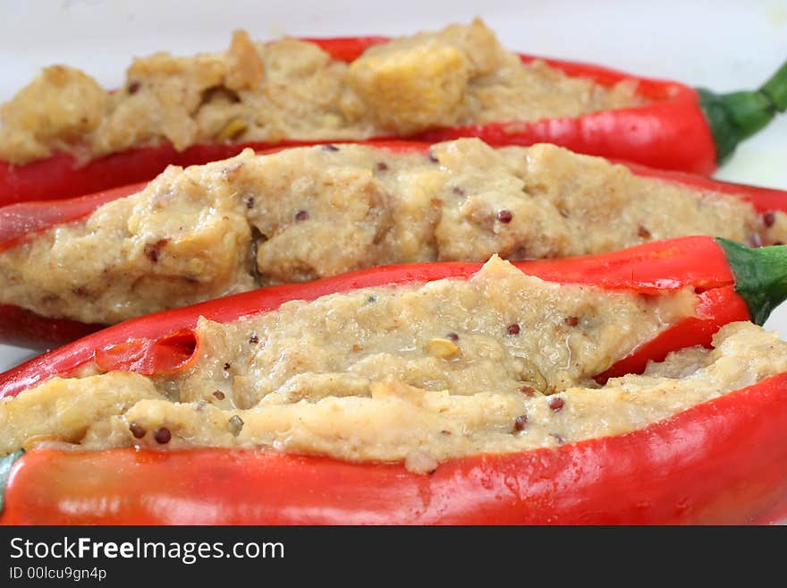 Stuffed chilies with fish korma paste paired with red wine