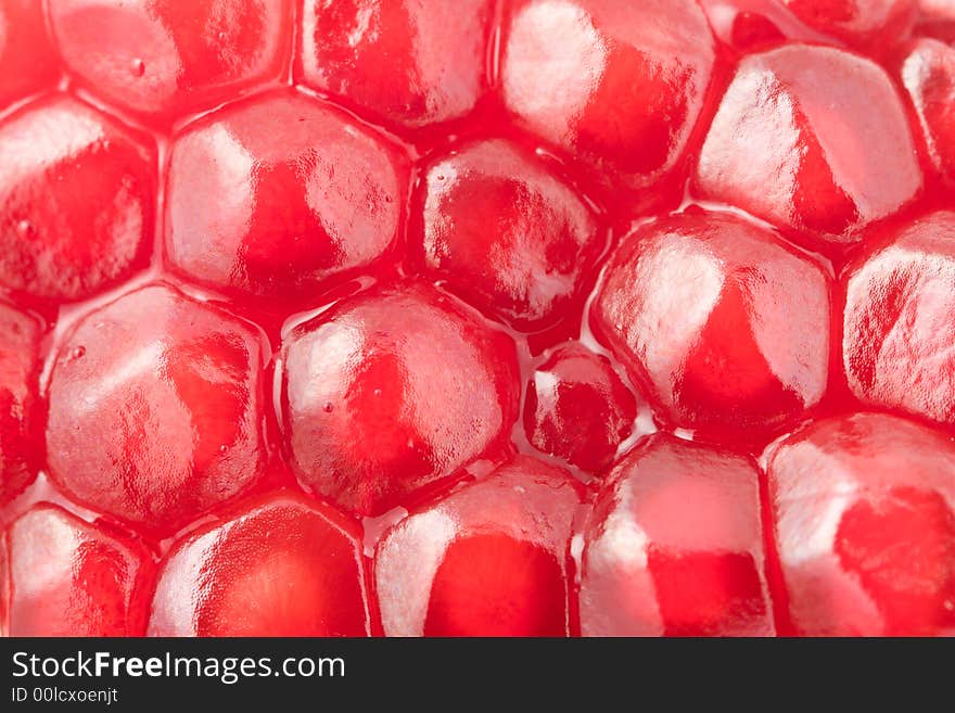 Ripe pomegranate grains macro. Red grains. Ripe pomegranate grains macro. Red grains.