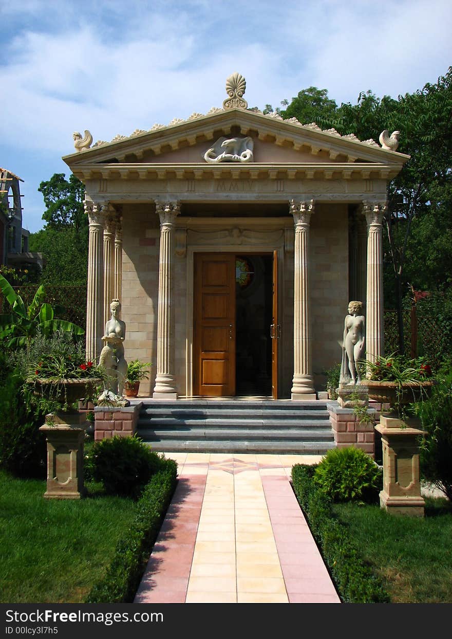 A road leading to the gates of an ancient roman temple. A road leading to the gates of an ancient roman temple