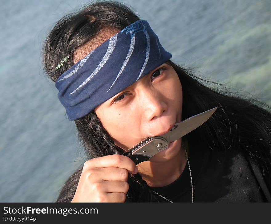 Pirate girl in south of Philippines on the rock. Pirate girl in south of Philippines on the rock