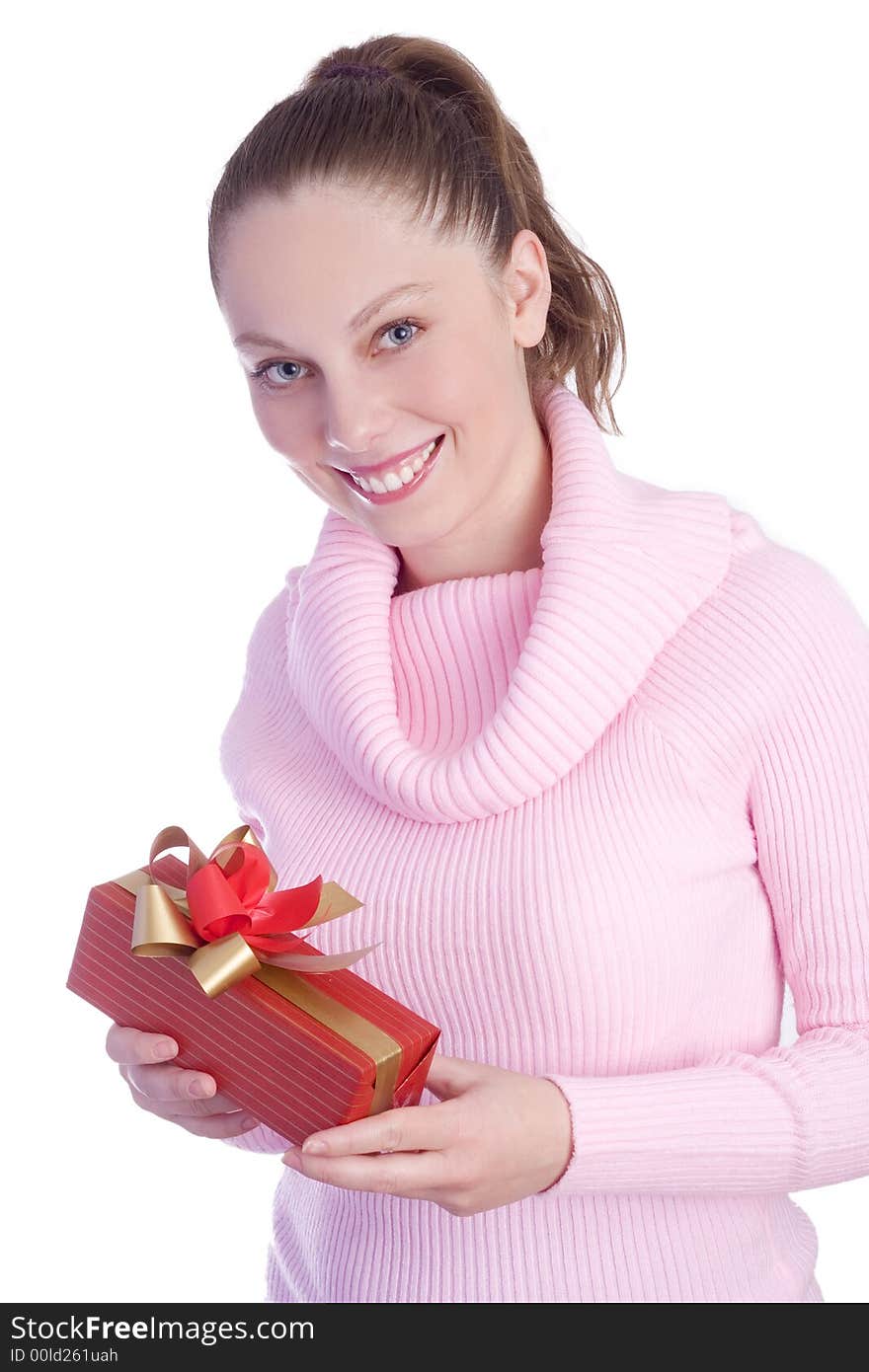 Beautiful young girl in pink holding red gift isolated on white background. Beautiful young girl in pink holding red gift isolated on white background