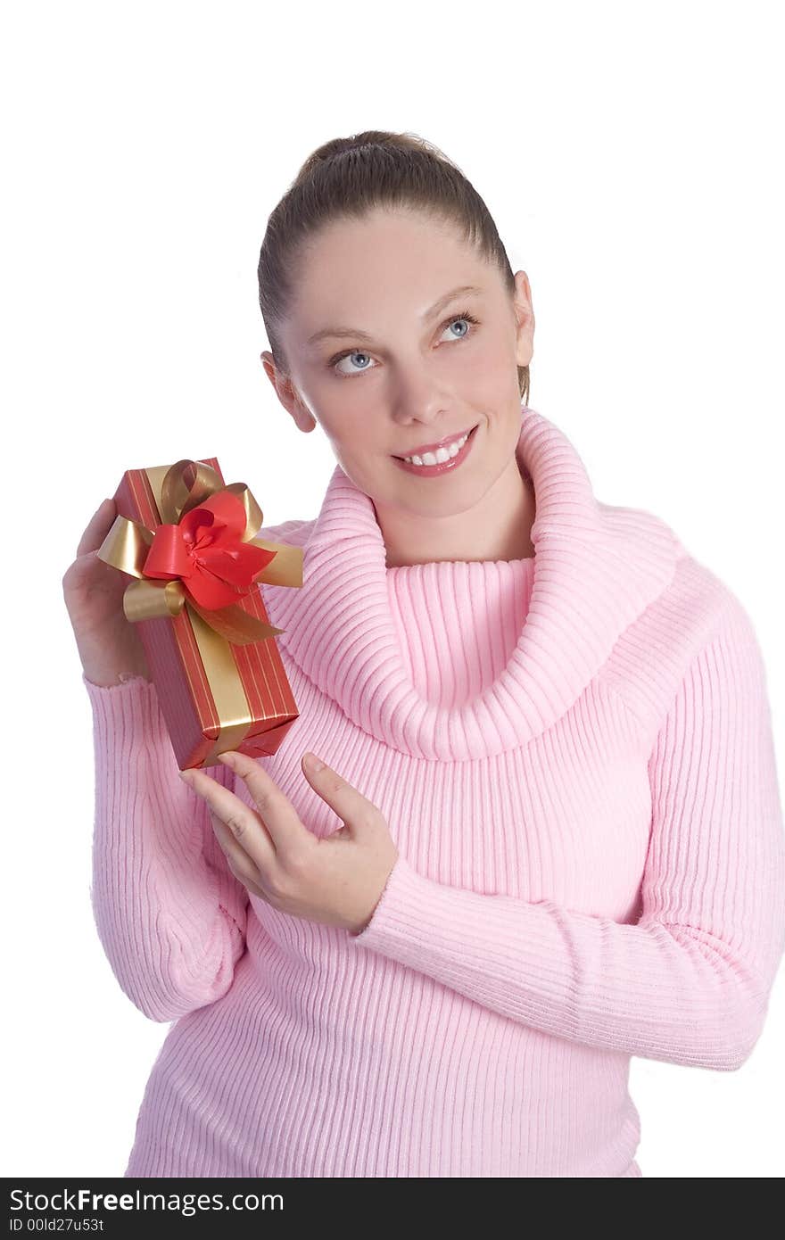 Beautiful young girl in pink holding red gift isolated on white background. Beautiful young girl in pink holding red gift isolated on white background