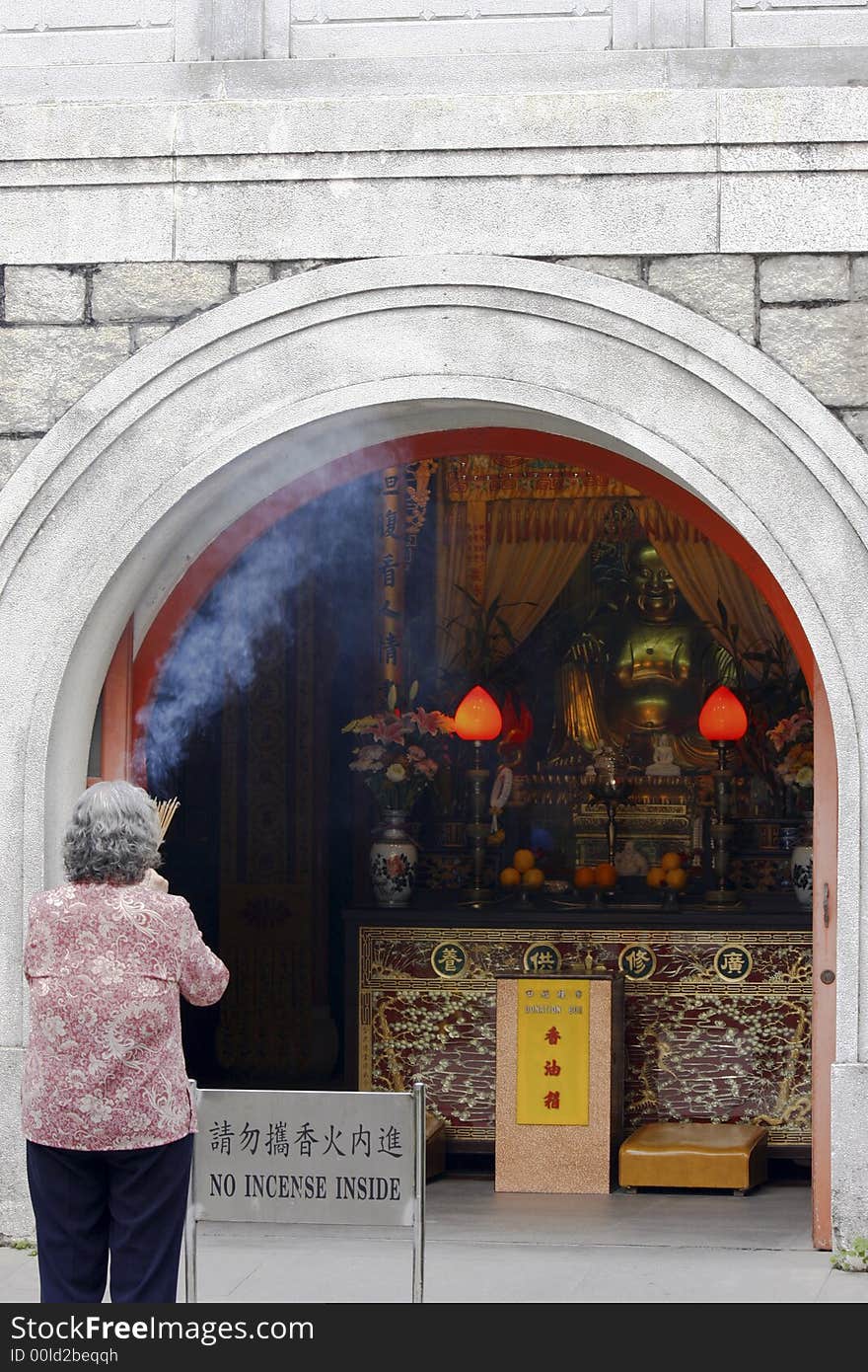 Worshiper outside a buddha temple. Worshiper outside a buddha temple