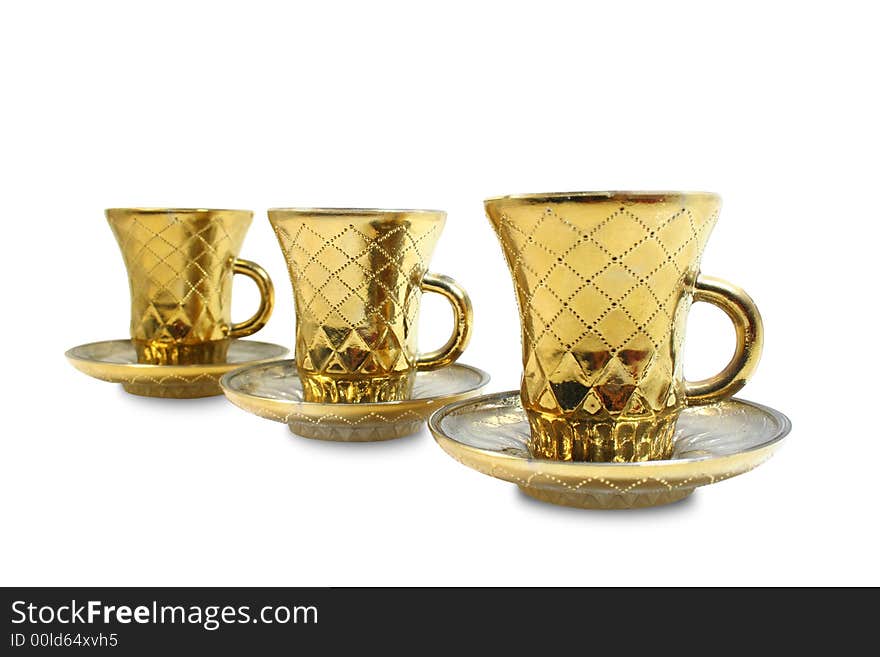 Three isolated gilt cups in a row. Three isolated gilt cups in a row