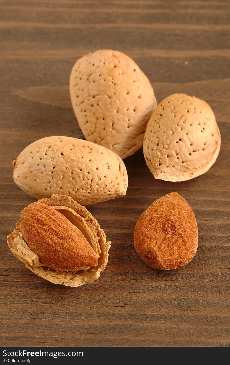 Group of almonds with background of wood