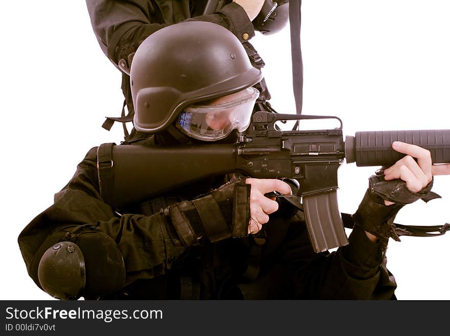 Shot of a soldier holding gun. Uniform conforms to special services(soldiers) of the NATO countries. Shot of a soldier holding gun. Uniform conforms to special services(soldiers) of the NATO countries.