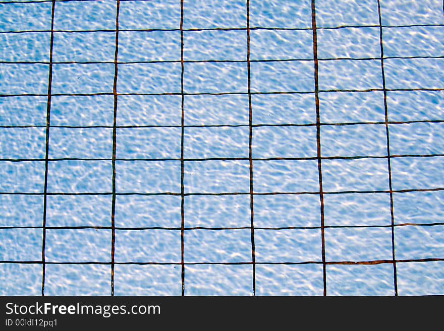 Swimming pool water background with the pattern of the tiles in the bottom showing. Swimming pool water background with the pattern of the tiles in the bottom showing.