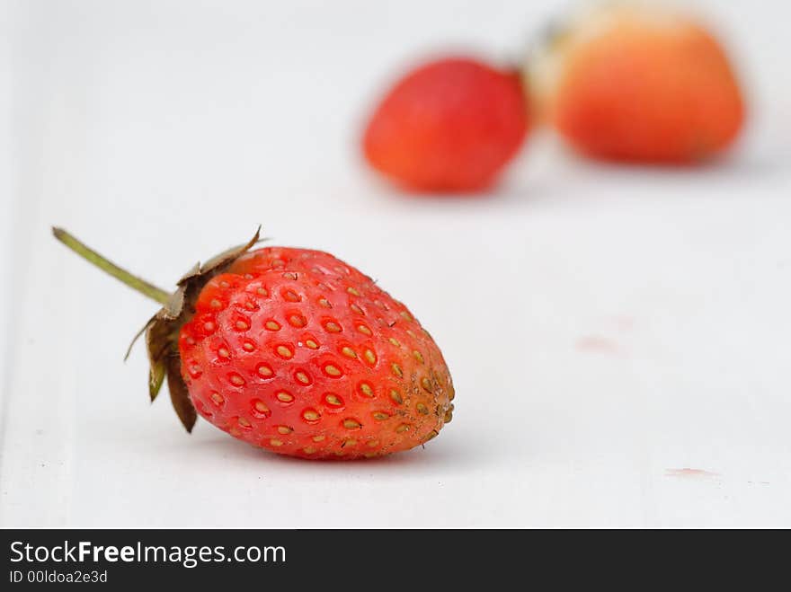 Photography of strawberries on a with background. Photography of strawberries on a with background