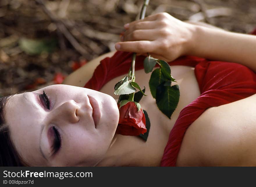 Young woman holding a rose