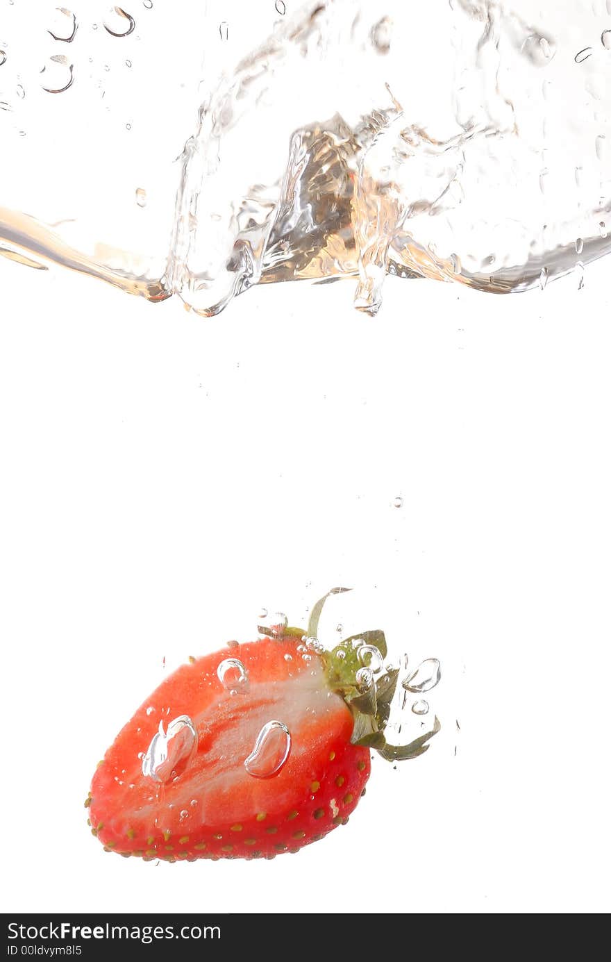 Photography of a strawberry splashing in water