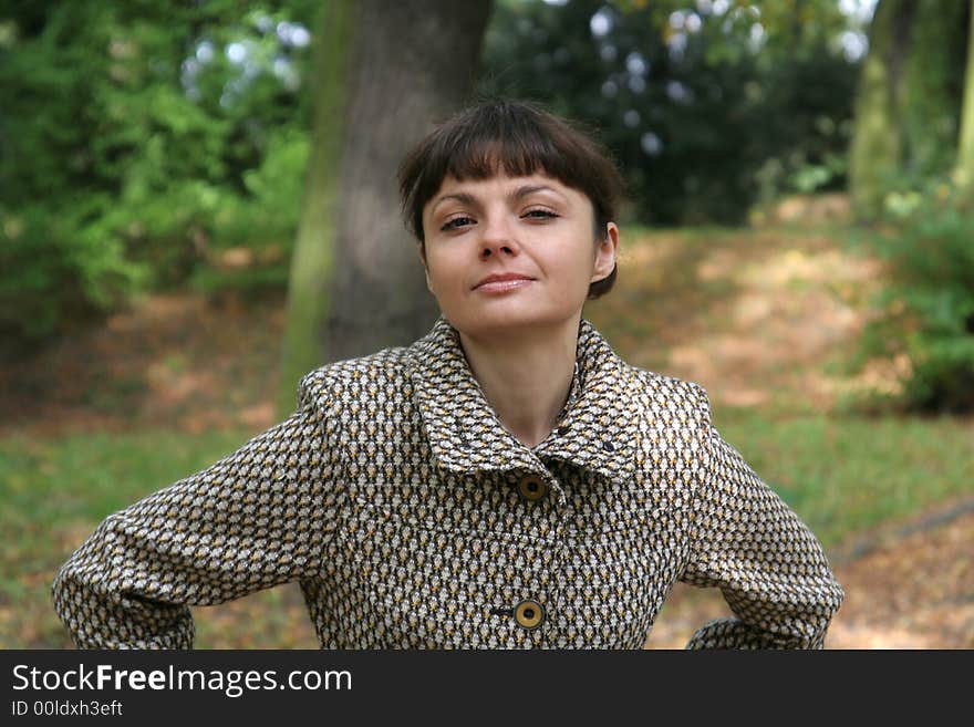 Beautiful woman walking in the autumn park. Beautiful woman walking in the autumn park