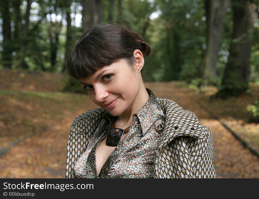 Beautiful woman walking in the autumn park. Beautiful woman walking in the autumn park