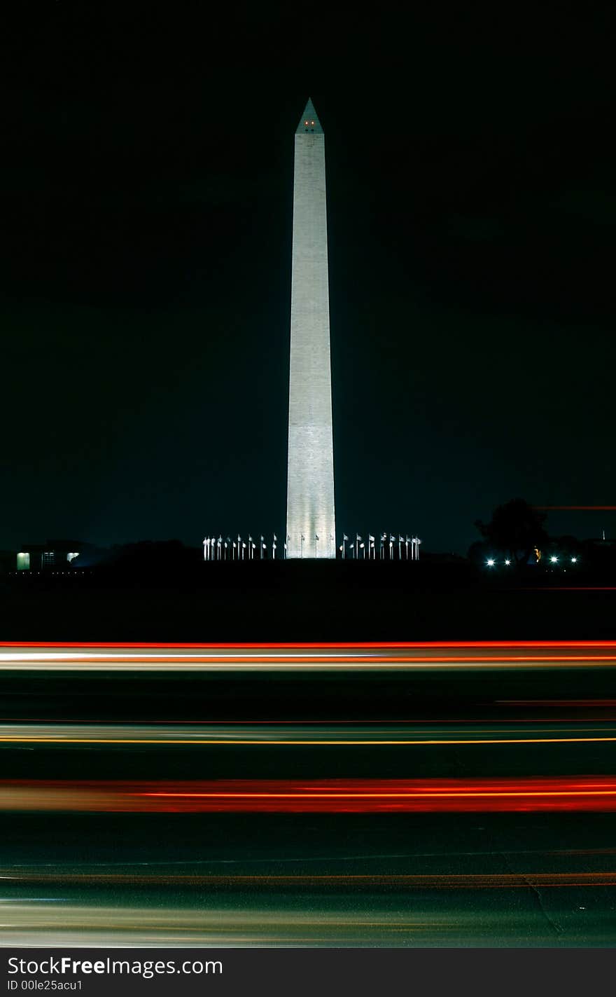 Night shot of the washington monument in washington D.C. - foreground with motion blurred traffic