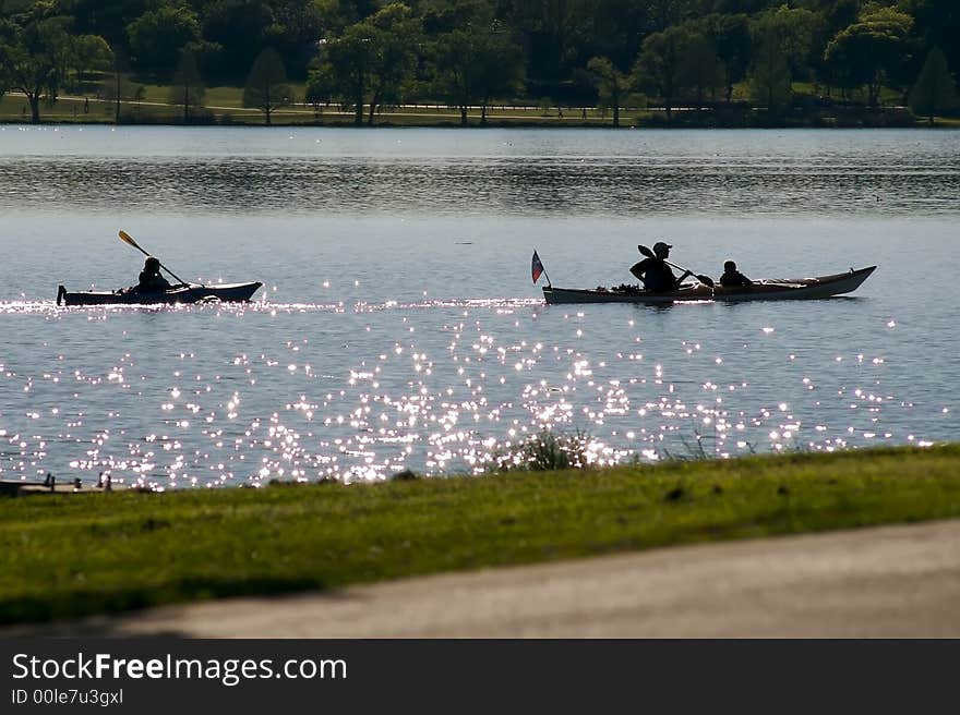 A pair of kayakers making their way down a river.