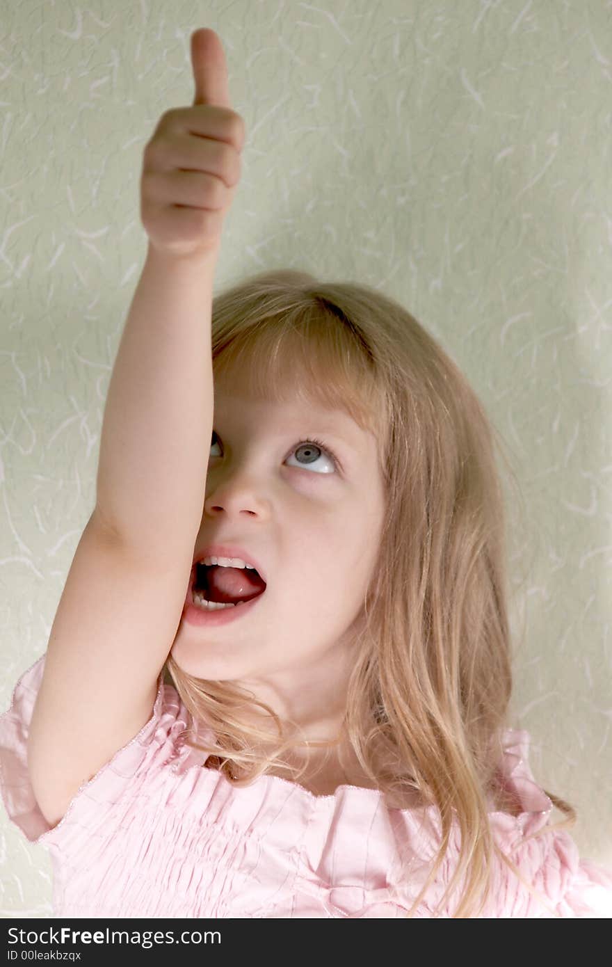 An image of girl looking on her thumb. An image of girl looking on her thumb