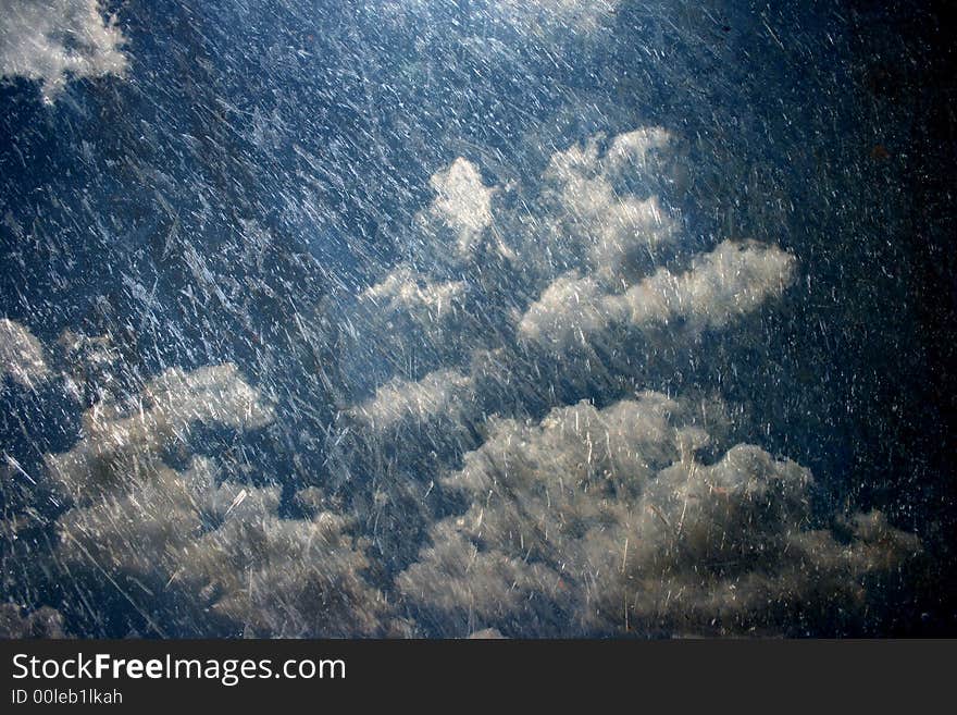 A scratched steel etching of dark rain clouds. A scratched steel etching of dark rain clouds