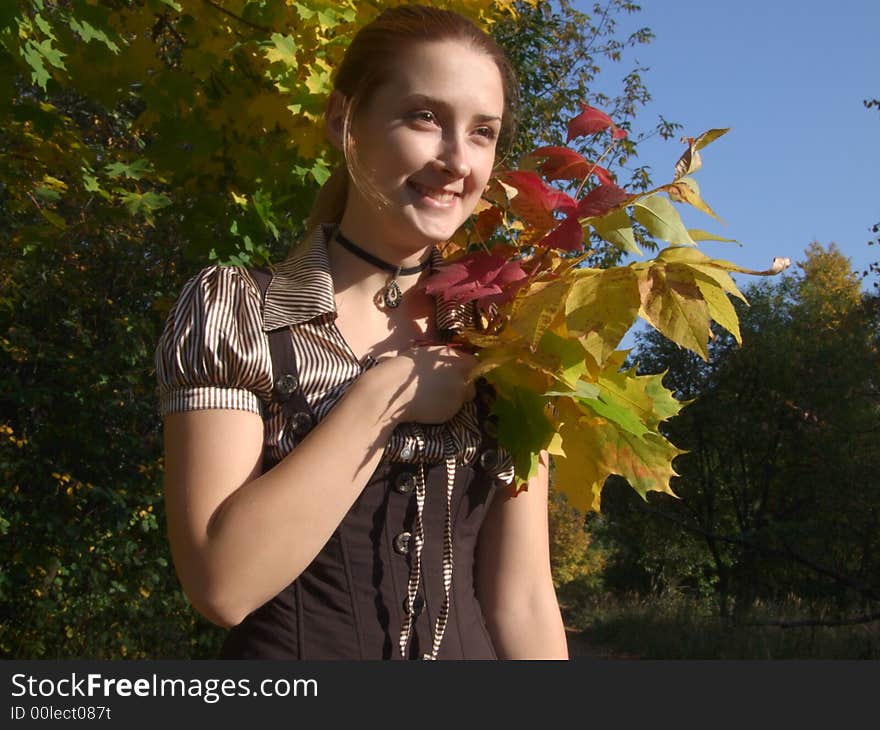 A girl with bouquet In autumn