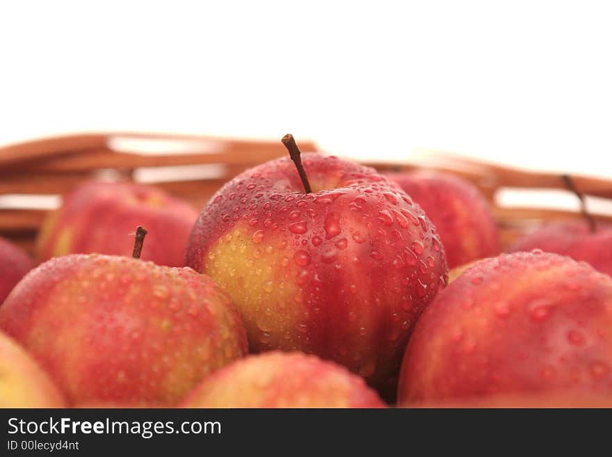 Many red apples on a white background