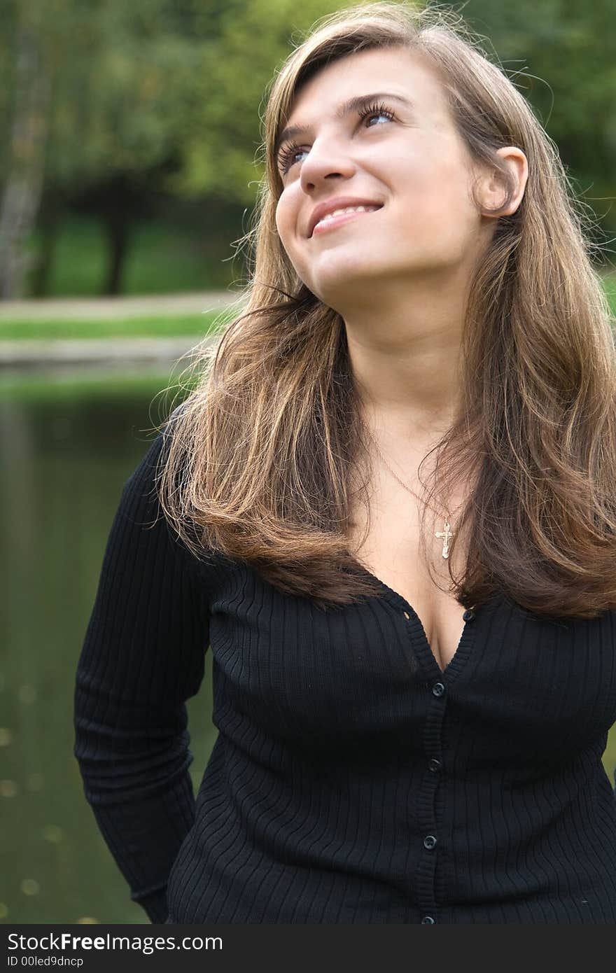 Portrait of beautiful smiling girl in park