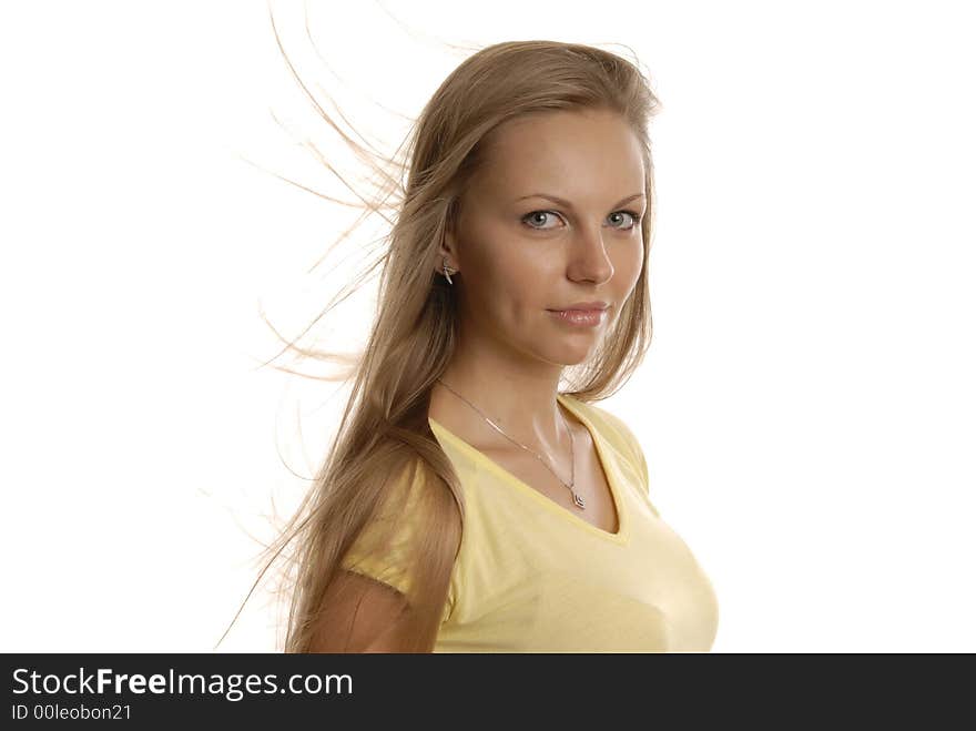 A girl in yellow short with blonde tousled hair. A girl in yellow short with blonde tousled hair