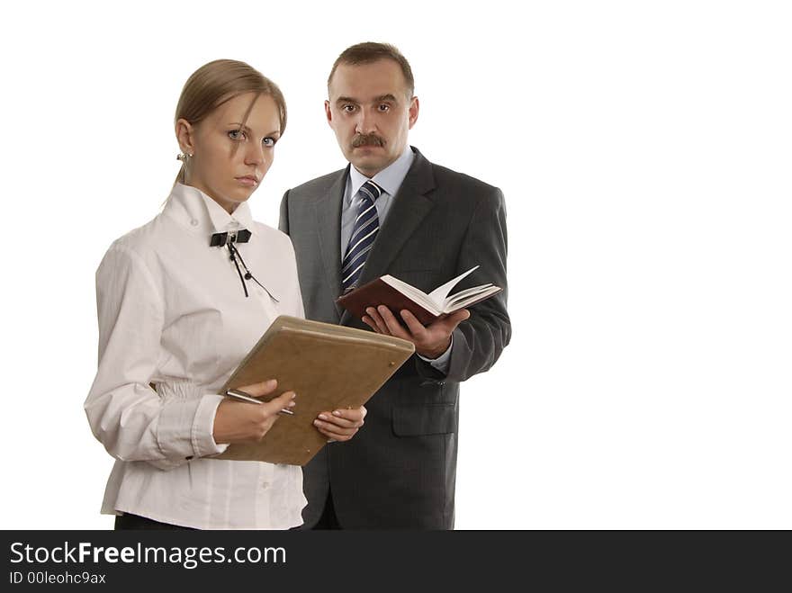 Serious man and a woman in office with document on the white background. Serious man and a woman in office with document on the white background