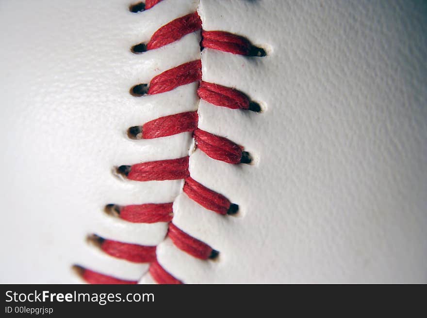 A white Baseball Macro with red stitching