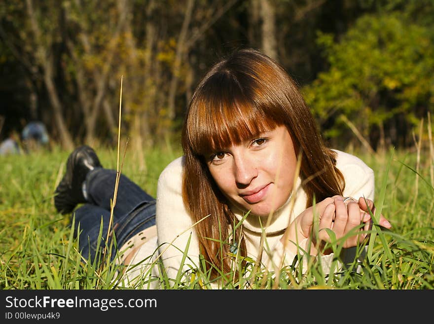 Young girl lying on the grass