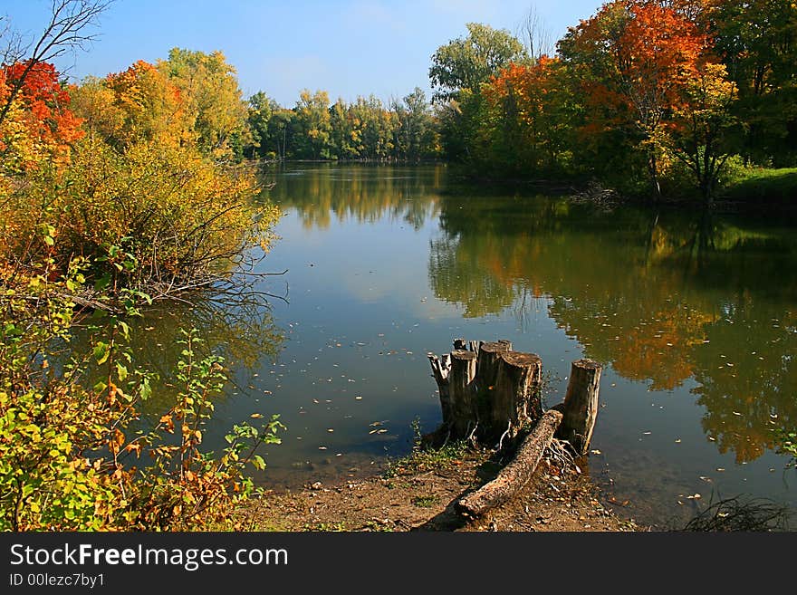 Autumn colors reflecting on lake. It was a nice calm morning, so the reflection is excellent.

Check my portfolio for many autumn images.