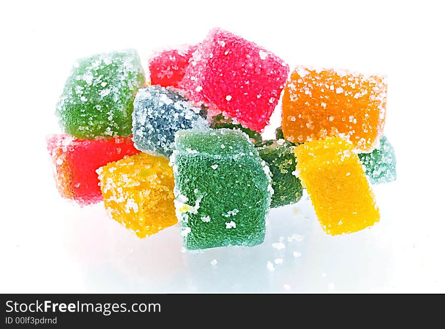 Delicious and colorful  jelly cubes on white background