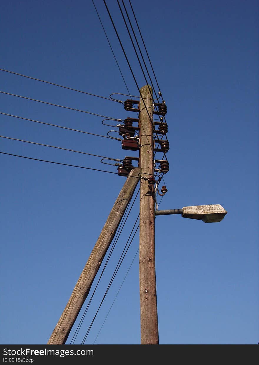 Old energy pole with a street lamp