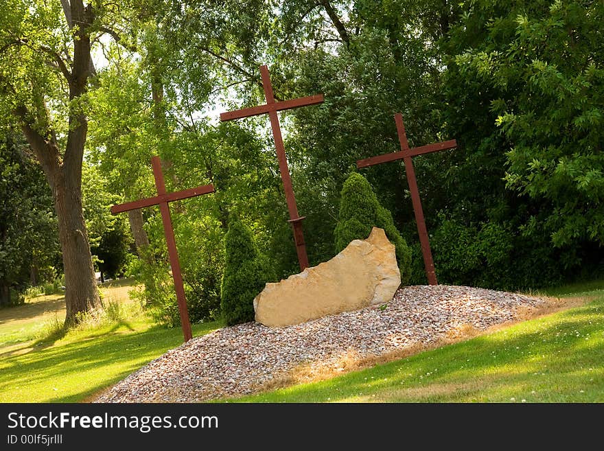 Three tall Christian crosses at a park memorial. Three tall Christian crosses at a park memorial.